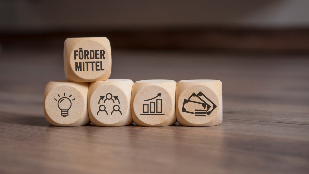 Würfel mit Fördermittel, Link auf NRW-Förderprogramm "2.000 mal 1.000 Euro für das Engagement" - Stadt Köln