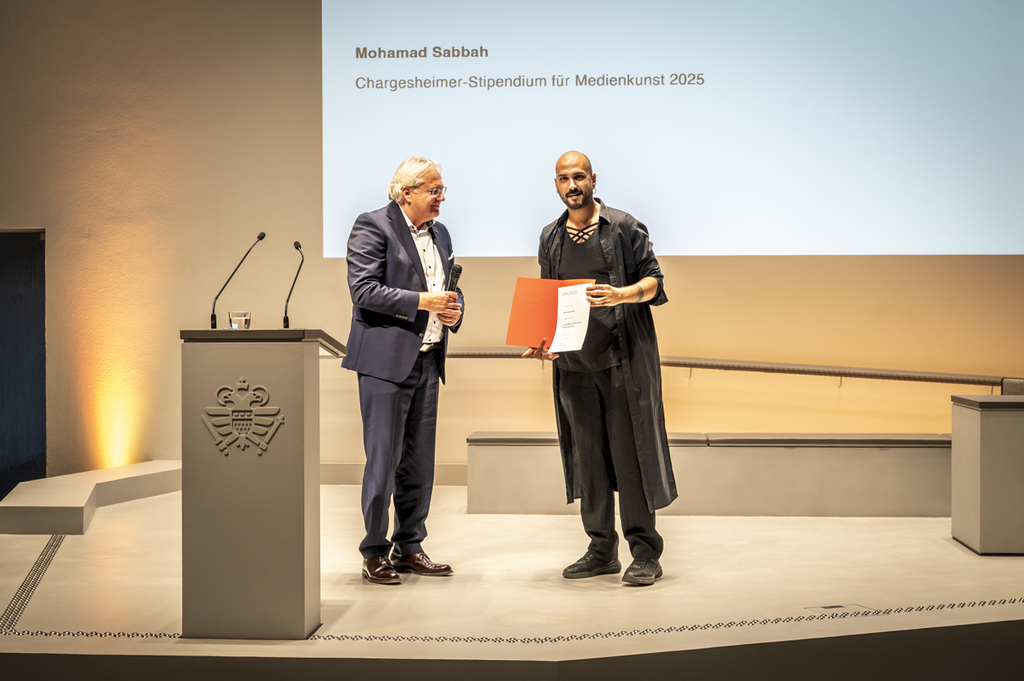 Dr. Ralph Elster ehrt Mohamad Sabbah mit dem Chargesheimer-Stipendium