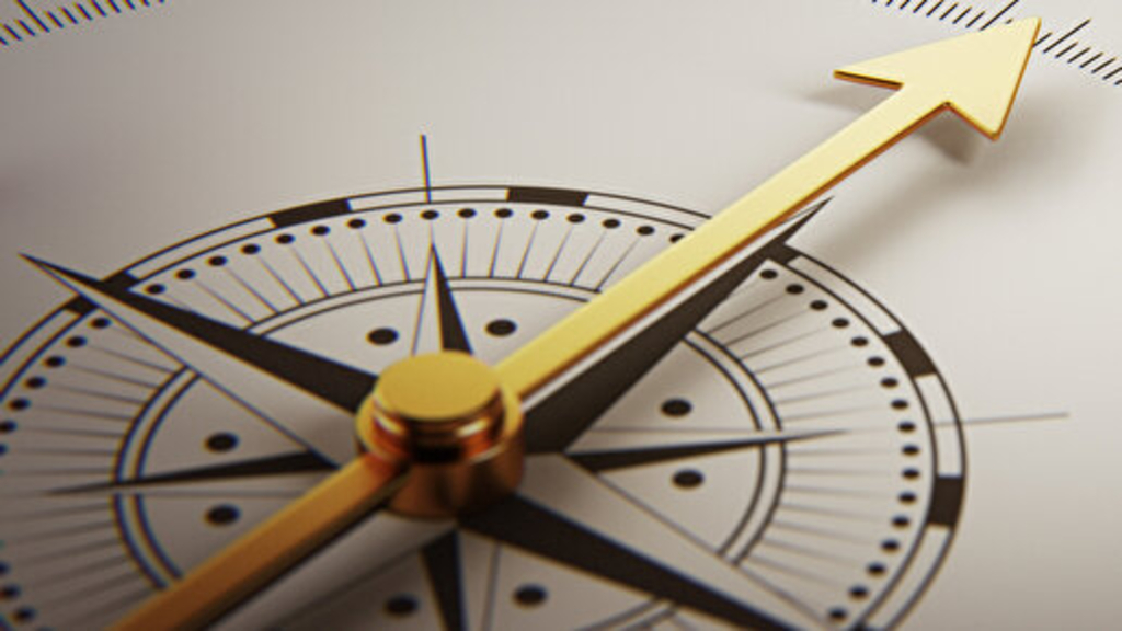 Kompass zeigt auf das Wort Coaching