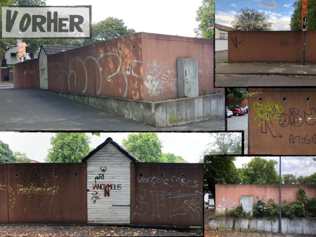 Garagenwand am Kirchplatz vor der Aufwertung durch die Bürger*in