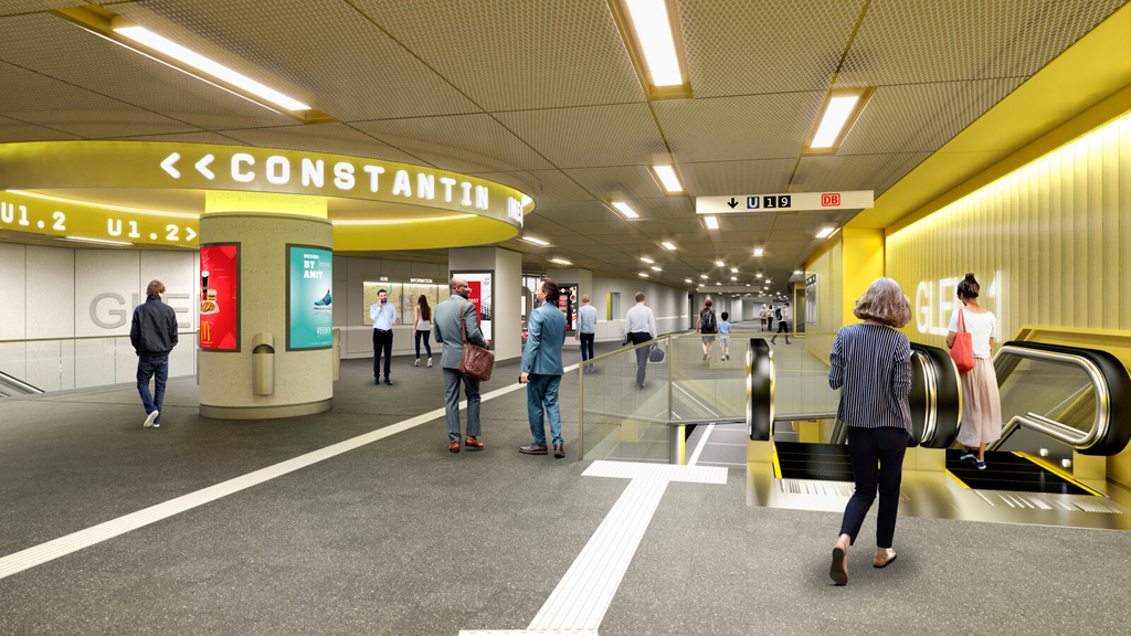 Zwischenebene der Stadtbahnhaltestelle Bahnhof Deutz/Messe als Visualisierung. Zu sehen ist ein langer Gang,  einige Menschen und Rolltreppen, die zu den Gleisen führen.