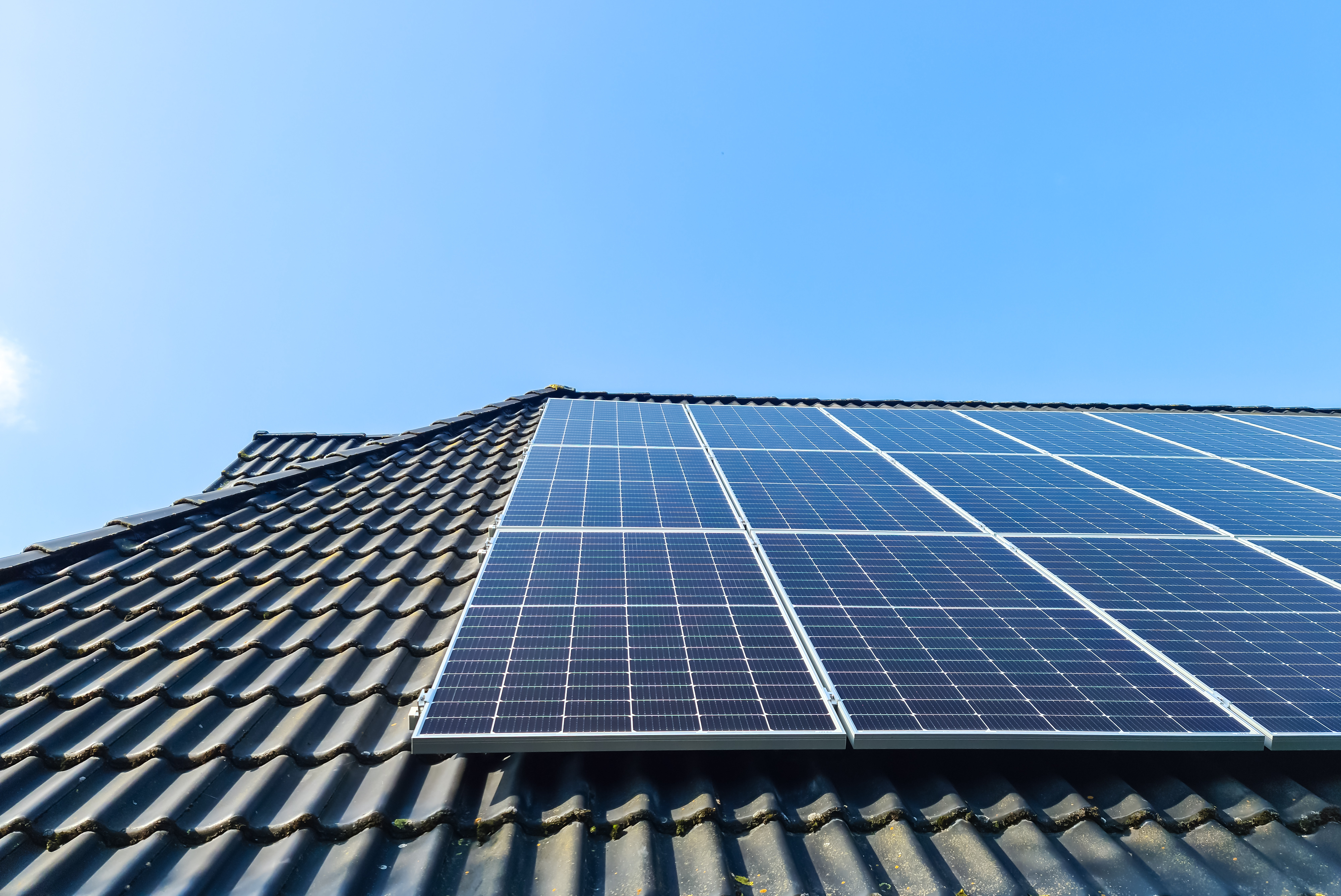 Solar panels producing clean energy on a roof of a residential h, © Michael Piepgras